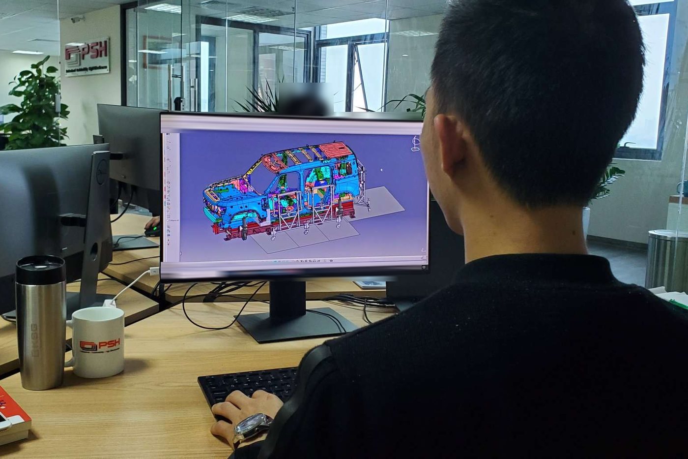 Cubing design in CATIA at PSH Design | PSH Design A PSH Design engineer working on a full-body cubing model in CATIA
